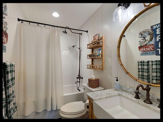 full bathroom featuring shower / bath combo, vanity, and toilet