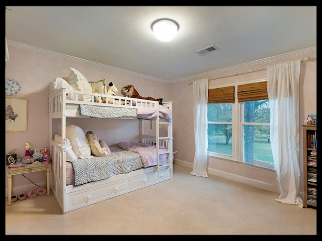 bedroom with baseboards, visible vents, crown molding, and carpet flooring