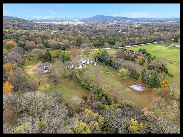 birds eye view of property with a rural view