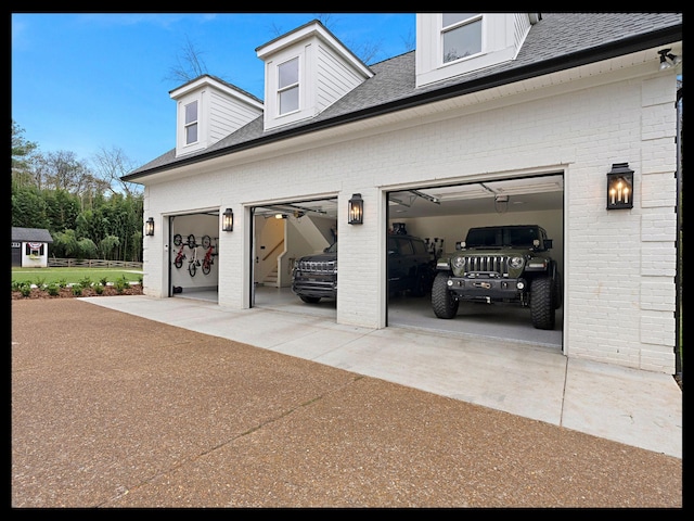 garage featuring driveway