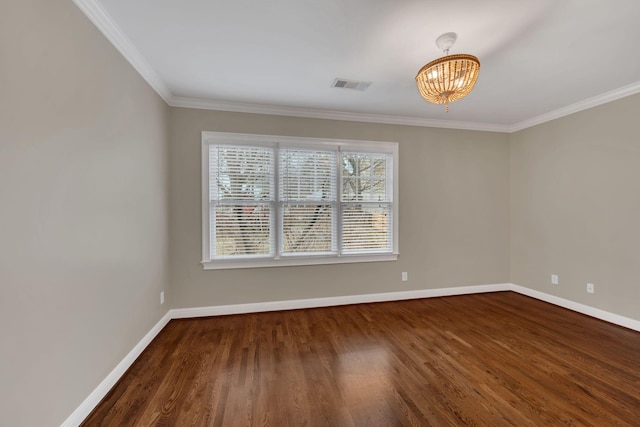 unfurnished room with dark wood-type flooring, crown molding, and a notable chandelier