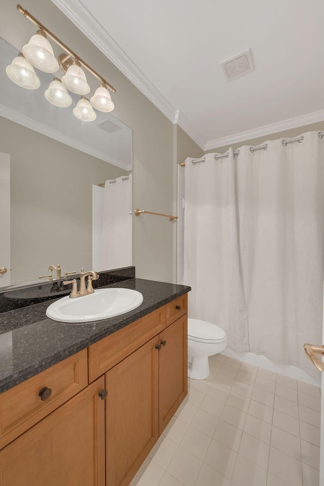 bathroom with vanity, crown molding, tile patterned floors, and toilet