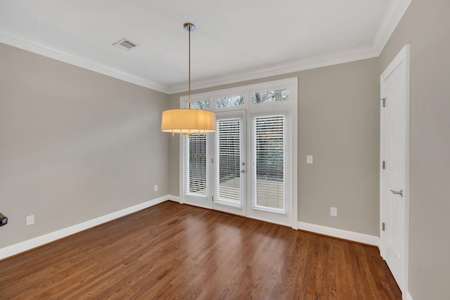 empty room with dark hardwood / wood-style flooring and crown molding