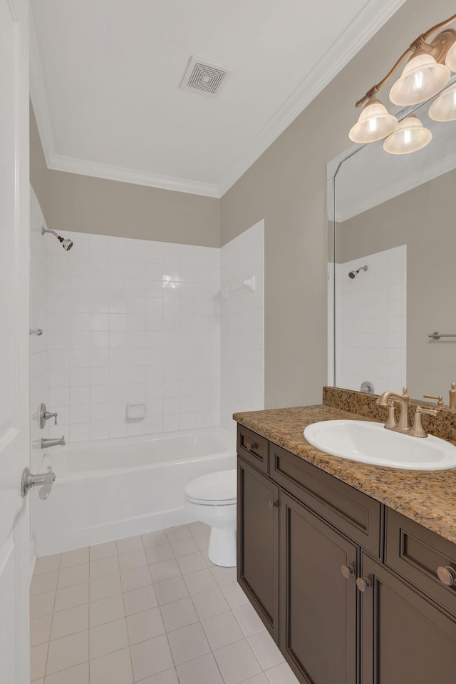 full bathroom with ornamental molding, tiled shower / bath, and toilet