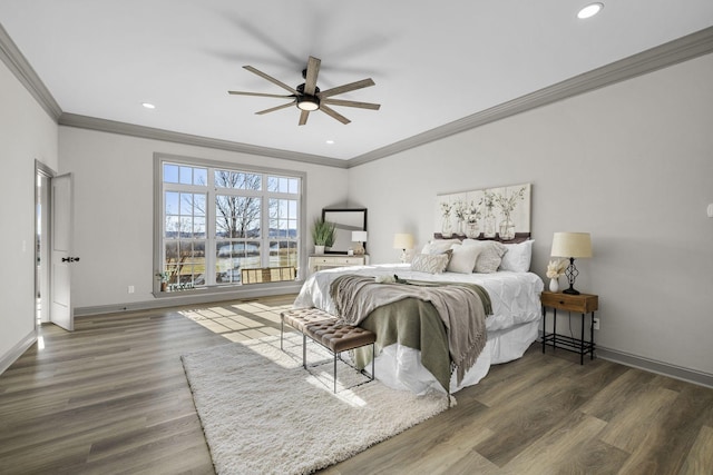 bedroom featuring ornamental molding, dark hardwood / wood-style floors, and ceiling fan