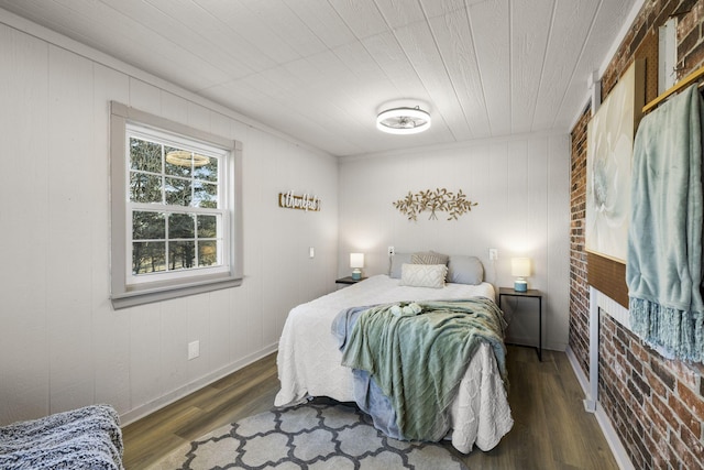 bedroom featuring dark hardwood / wood-style flooring