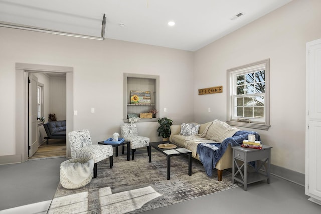 living room featuring concrete flooring