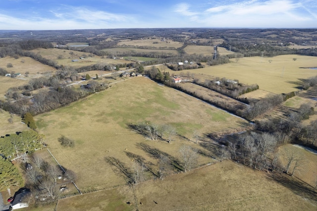 birds eye view of property featuring a rural view