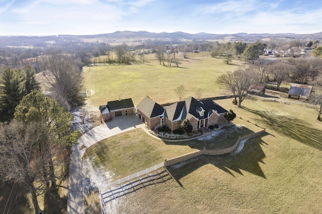 drone / aerial view featuring a rural view and a mountain view