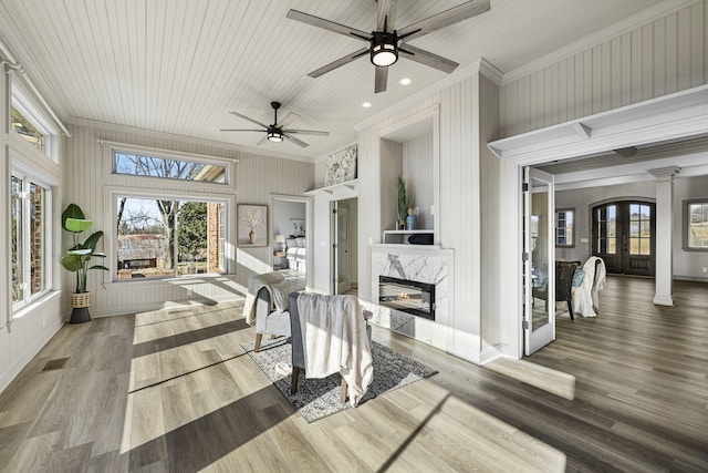 interior space featuring a premium fireplace and french doors