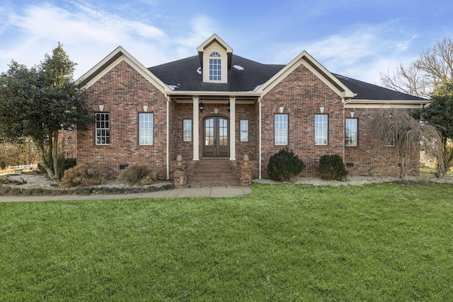 view of front facade with a front lawn and french doors