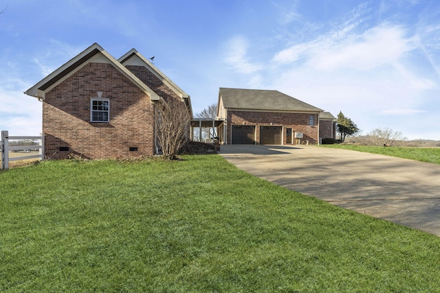 view of front facade with a garage and a front lawn