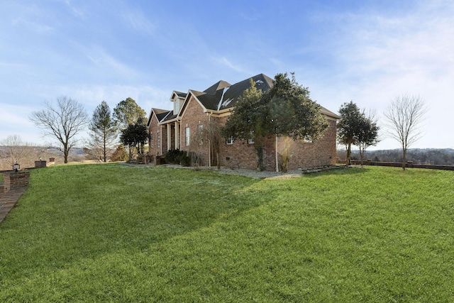 view of property exterior with a yard