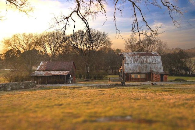 yard at dusk with an outdoor structure