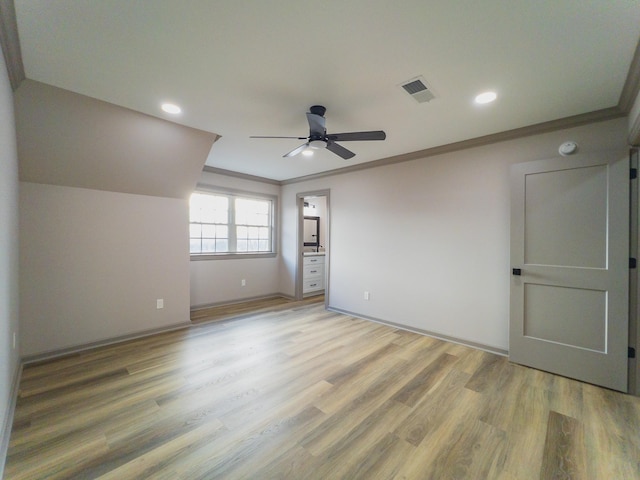 unfurnished bedroom featuring hardwood / wood-style flooring, ornamental molding, and ceiling fan