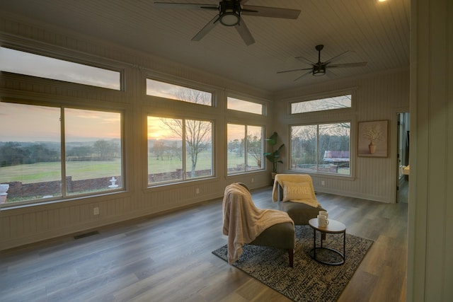 sunroom / solarium with wooden ceiling and ceiling fan