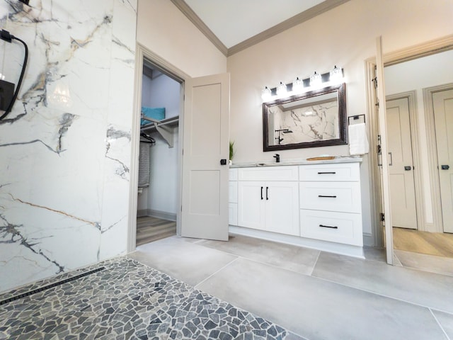 bathroom featuring crown molding and vanity
