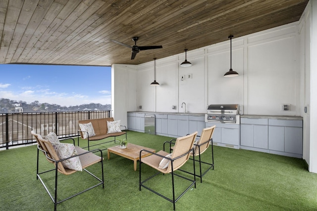 view of patio with an outdoor kitchen, area for grilling, sink, outdoor lounge area, and ceiling fan