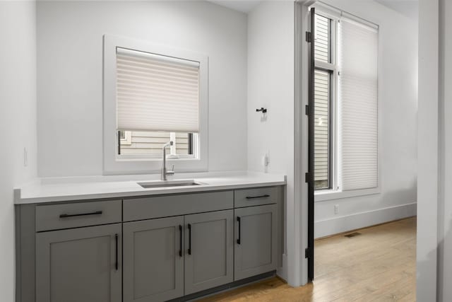 bathroom featuring vanity and hardwood / wood-style flooring