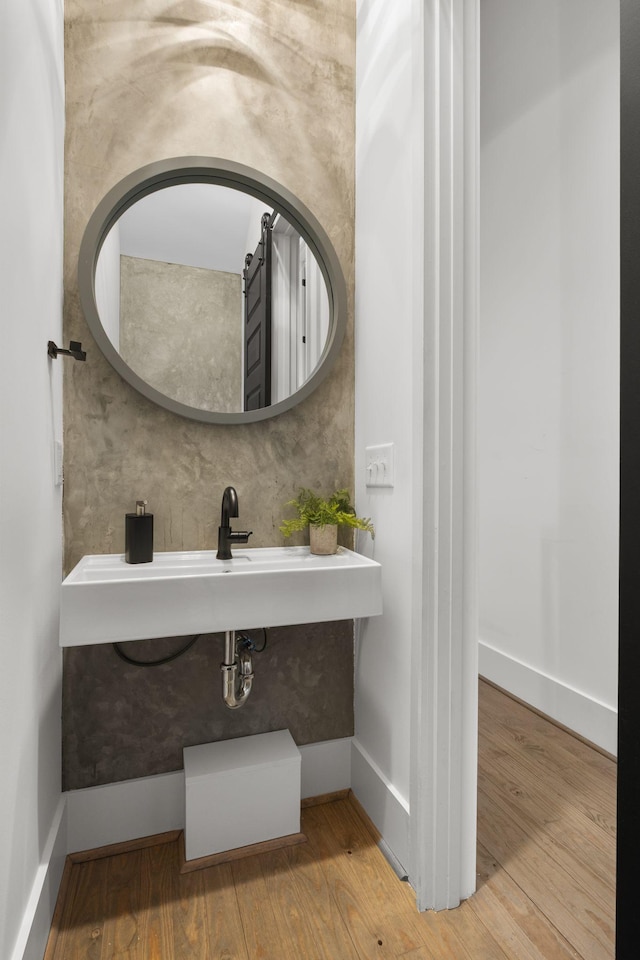 bathroom with hardwood / wood-style floors