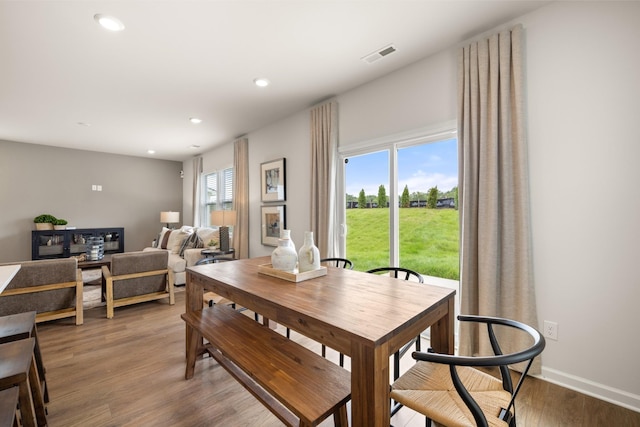 dining space featuring hardwood / wood-style floors