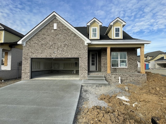 view of front facade with a porch and a garage