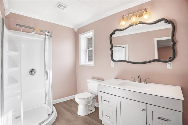 bathroom with hardwood / wood-style floors, vanity, ornamental molding, an enclosed shower, and toilet