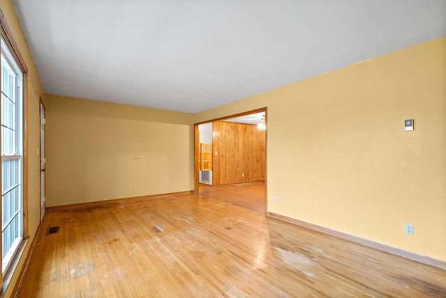 unfurnished room featuring light wood-type flooring