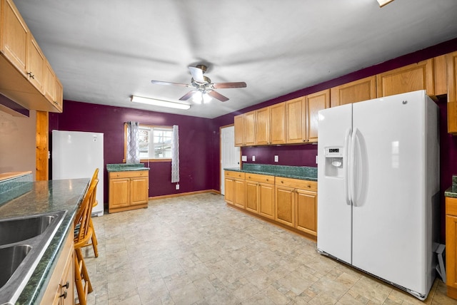 kitchen featuring white refrigerator, white refrigerator with ice dispenser, sink, and ceiling fan