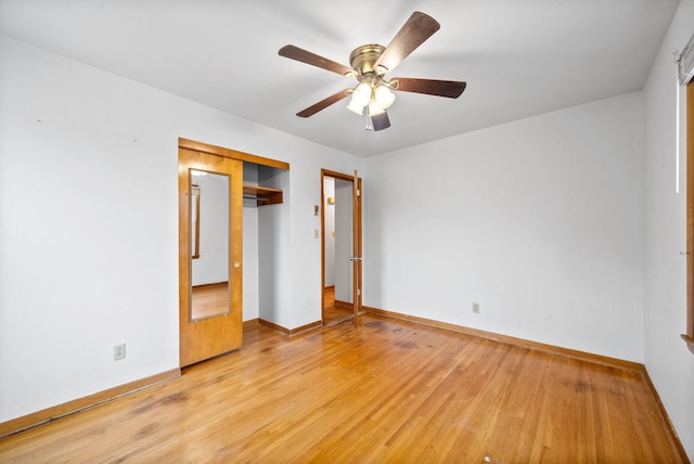 unfurnished bedroom with ceiling fan, a closet, and light wood-type flooring