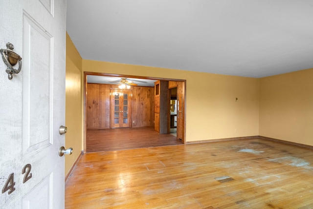 unfurnished room featuring ceiling fan and light wood-type flooring