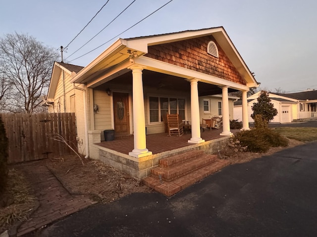 view of side of home with a porch