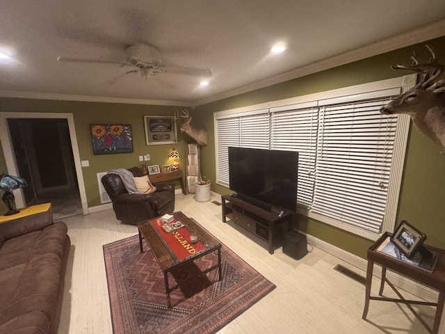 living area with ornamental molding, recessed lighting, a ceiling fan, and baseboards