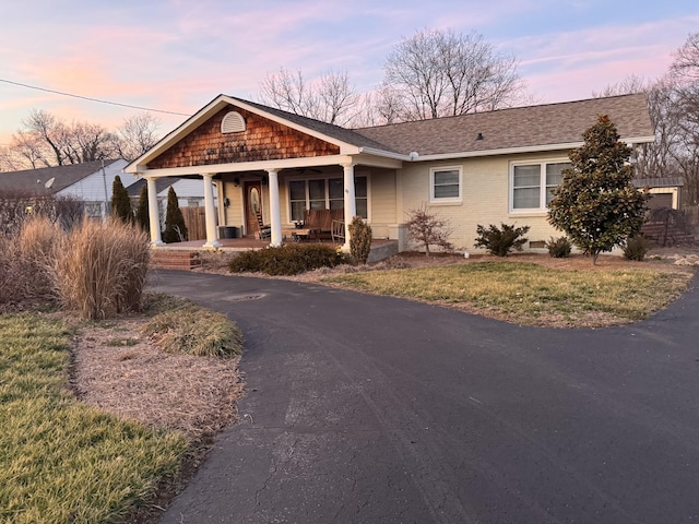 ranch-style house featuring a porch