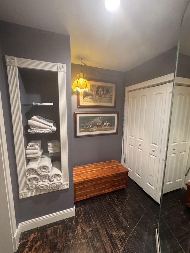 hallway with dark hardwood / wood-style floors