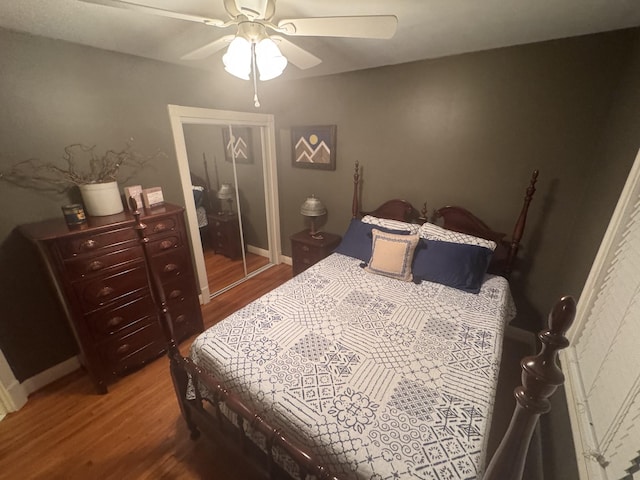 bedroom with hardwood / wood-style flooring and ceiling fan