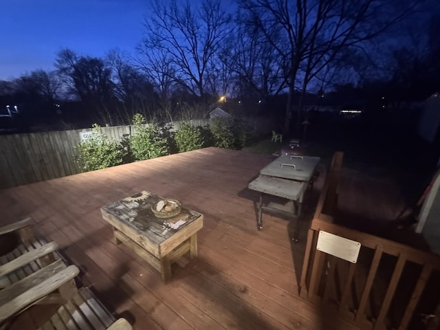 deck with a fenced backyard