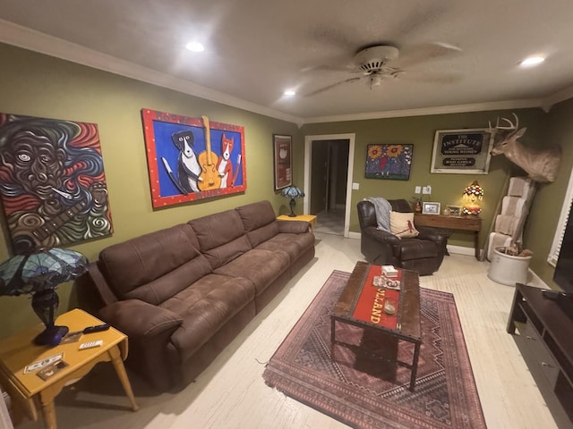 living room with crown molding, ceiling fan, and light wood-type flooring