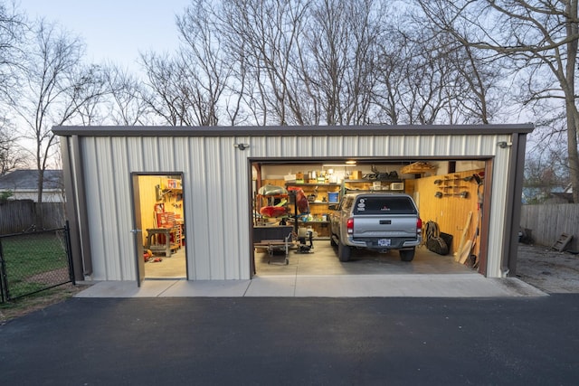 view of outbuilding with an outbuilding and fence