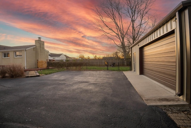 exterior space with a garage and fence