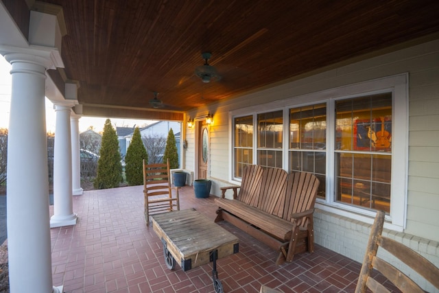 view of patio featuring a porch and a mountain view