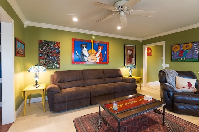 living room featuring baseboards, a ceiling fan, and crown molding