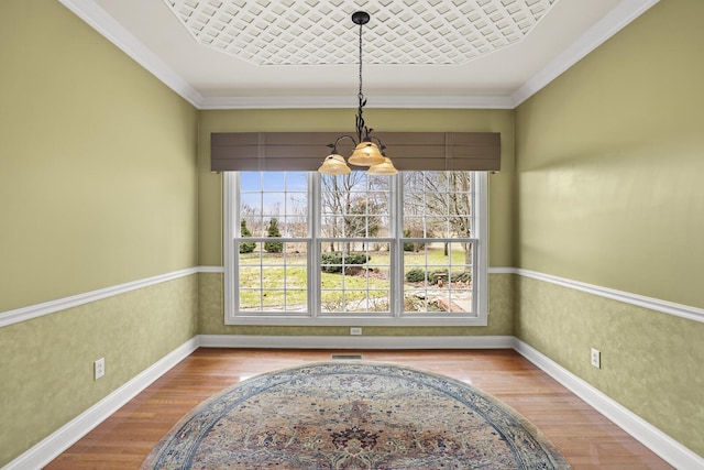 dining room featuring wood-type flooring and ornamental molding