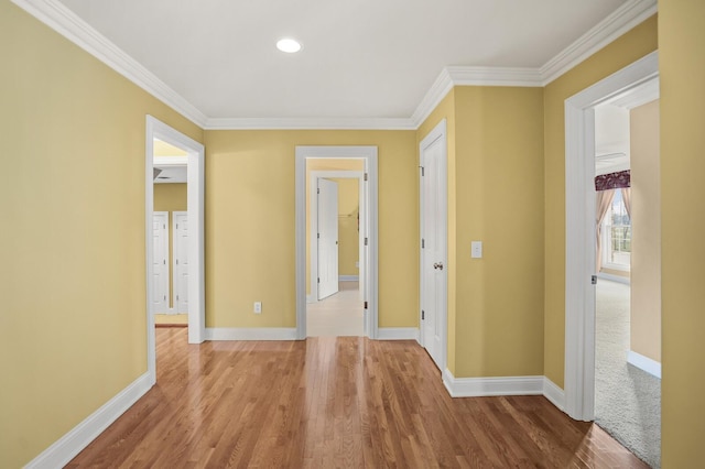 hall with crown molding and hardwood / wood-style flooring