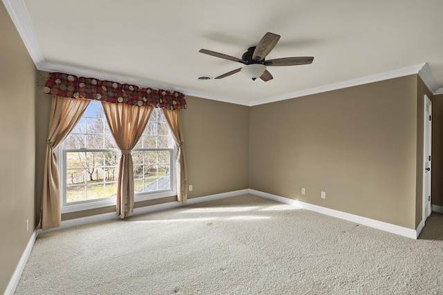 empty room with crown molding, ceiling fan, and carpet