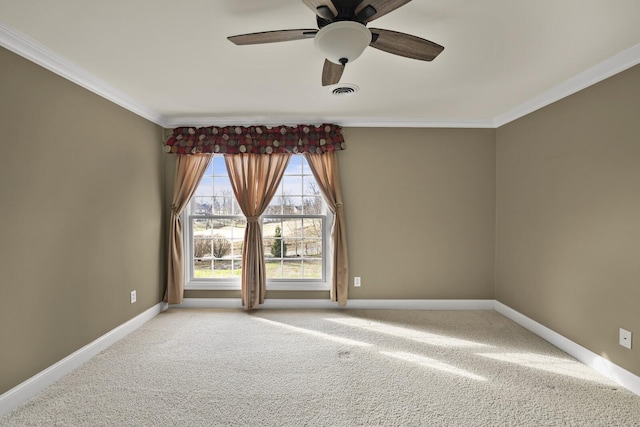 empty room featuring ornamental molding, light carpet, and ceiling fan