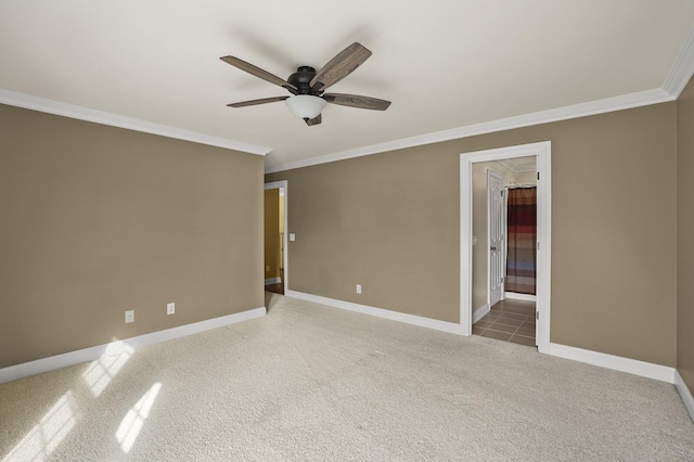 unfurnished room featuring ceiling fan, ornamental molding, and carpet