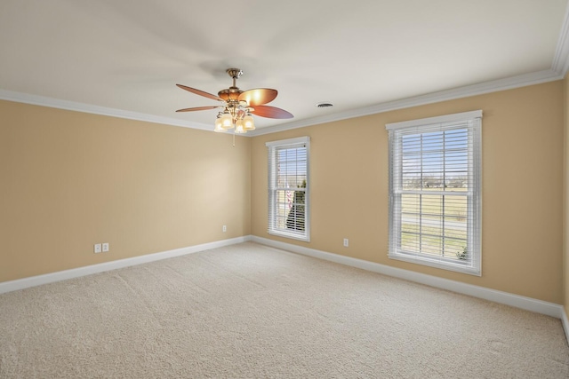 carpeted spare room with ornamental molding and ceiling fan