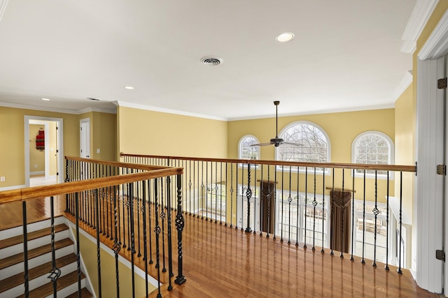 hall with crown molding and wood-type flooring