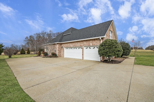 view of property exterior with a garage and a yard